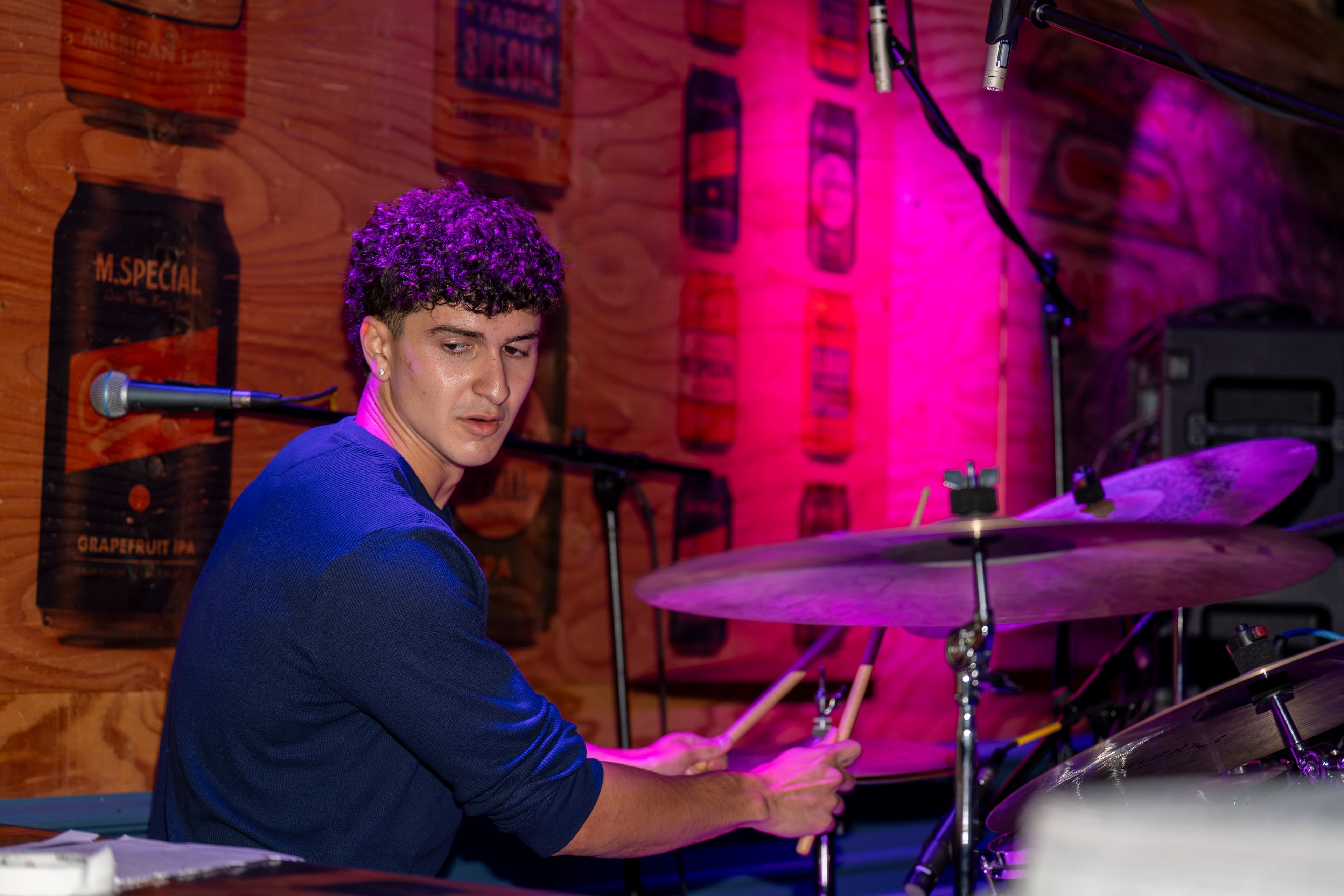Ryan playing drums during a live performance